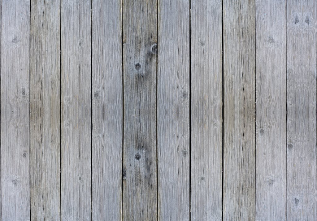 High-quality rustic wooden plank background with gray tones, perfect for design projects.